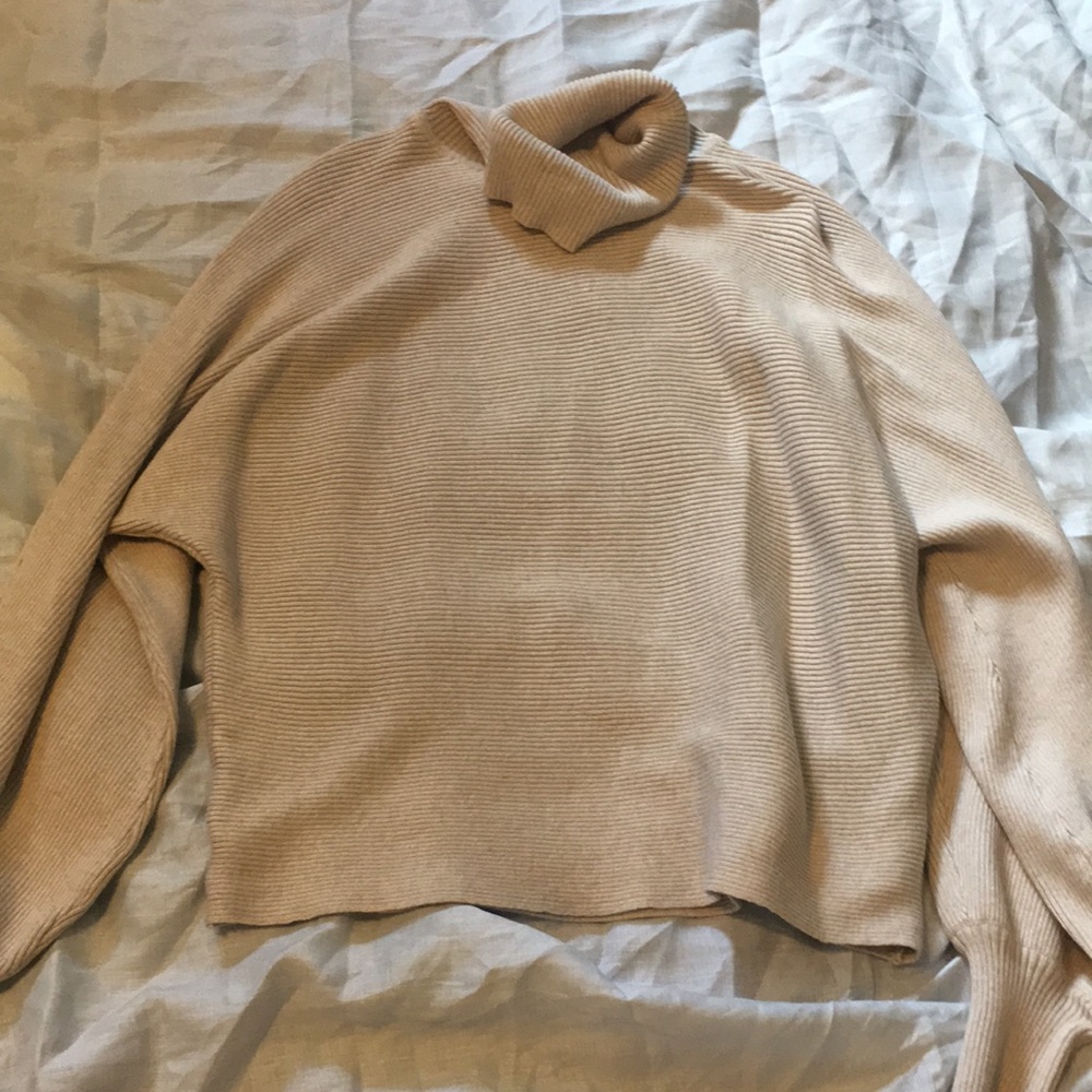 ribbed khaki colored turtleneck sweater